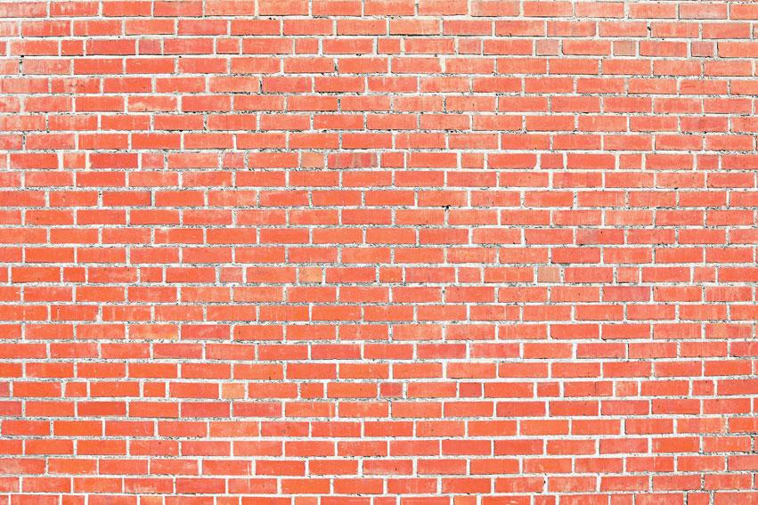 写真のためのkateつのオレンジ色のレンガの古いレトロな壁の背景