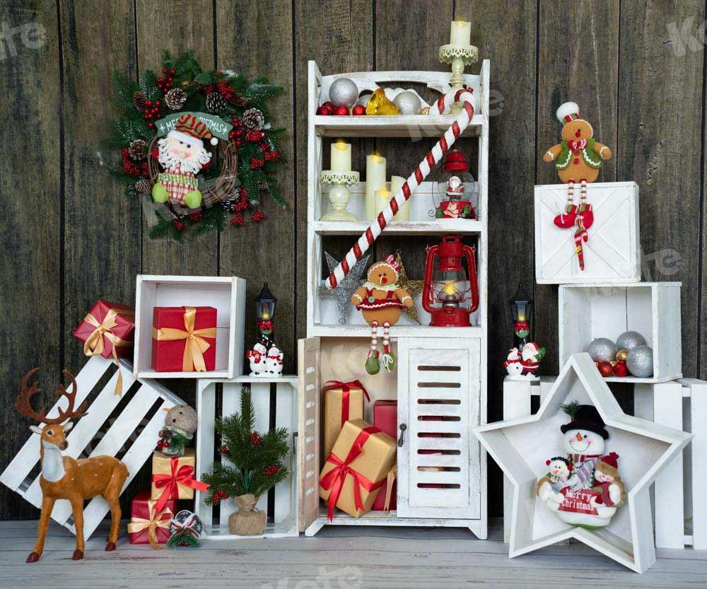 kateクリスマスギフトの背景の花輪の棚